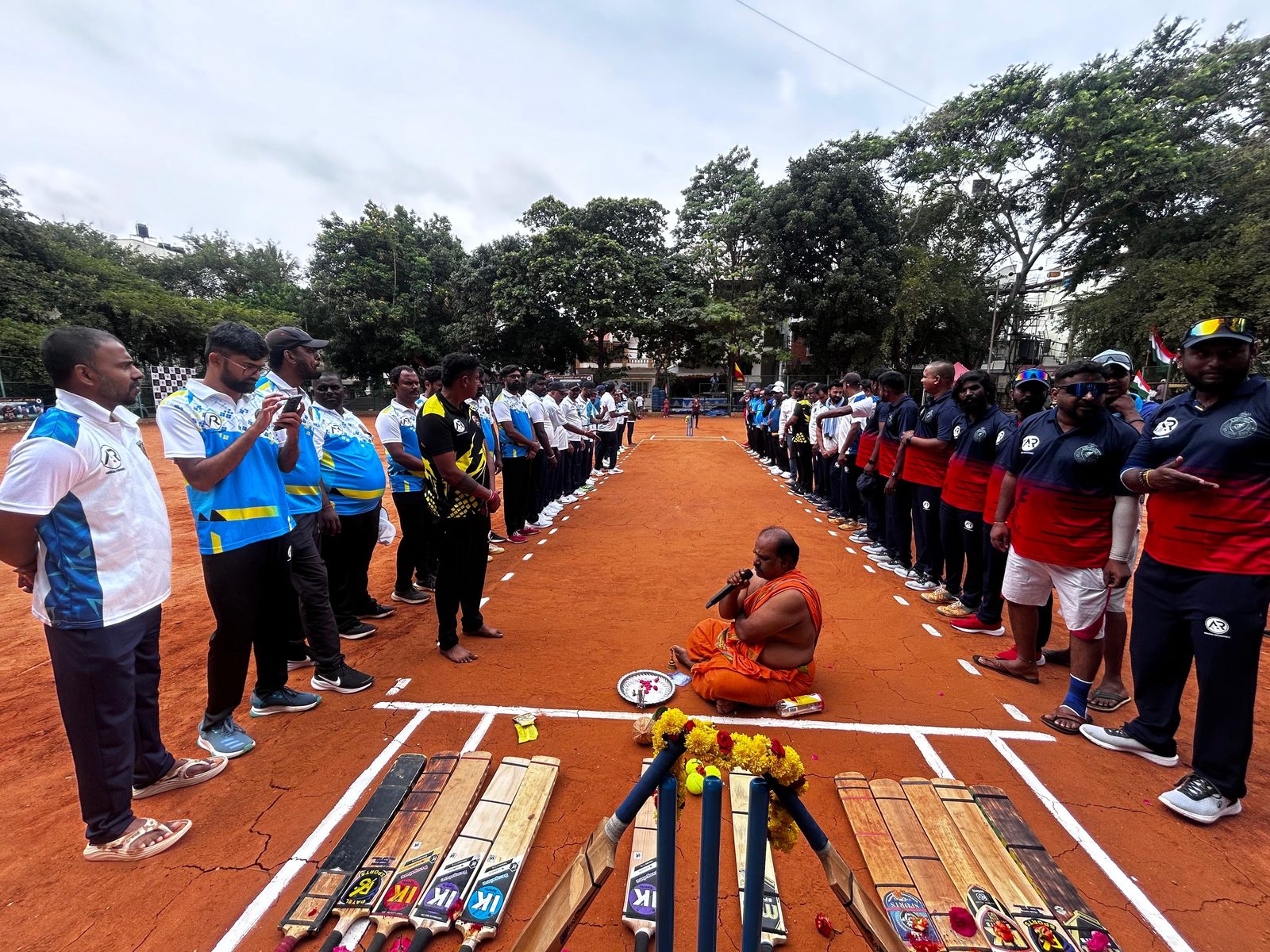Teams lined up on the pitch for the Kempapura Premier League opening ceremony, Kempapura, Bangalore